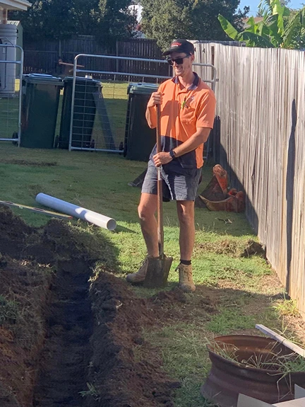 EVR Plumber preparing septic system trench and pipework for home installation