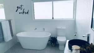 Modern bathroom plumbing upgrades with freestanding bath improving home value and efficiency