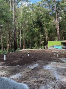 EVR Plumbing septic tank wastewater treatment system groundwork showing drainage pipes positioned before soil compaction